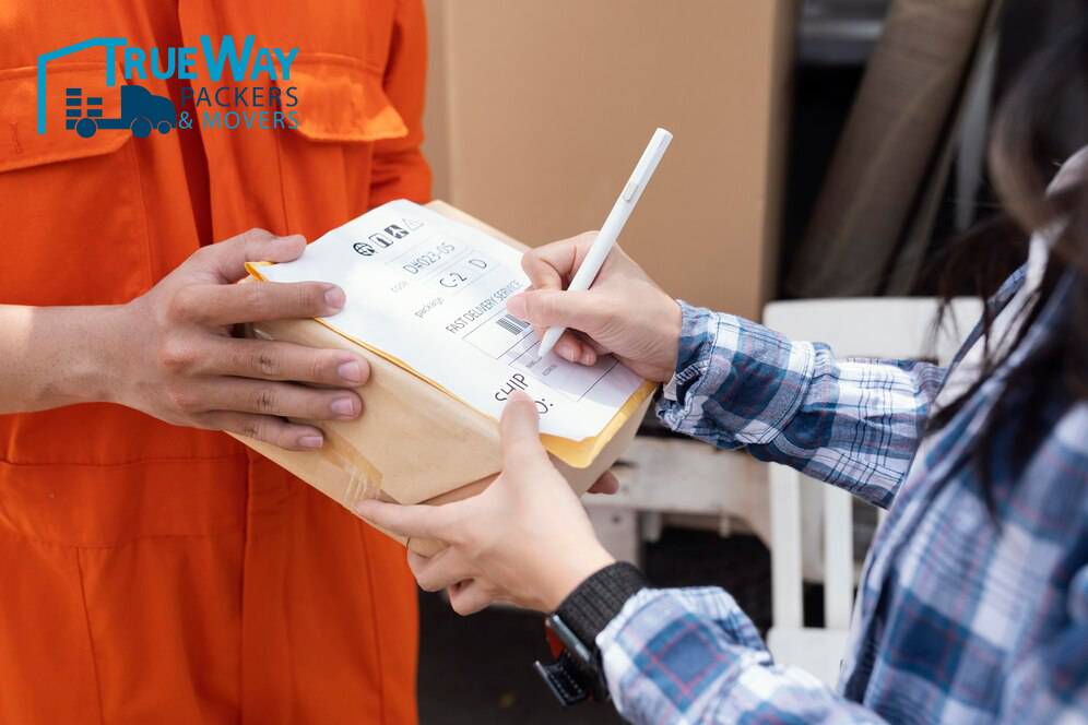 Close up person signing parcel delivery 23 2148944560 (1)